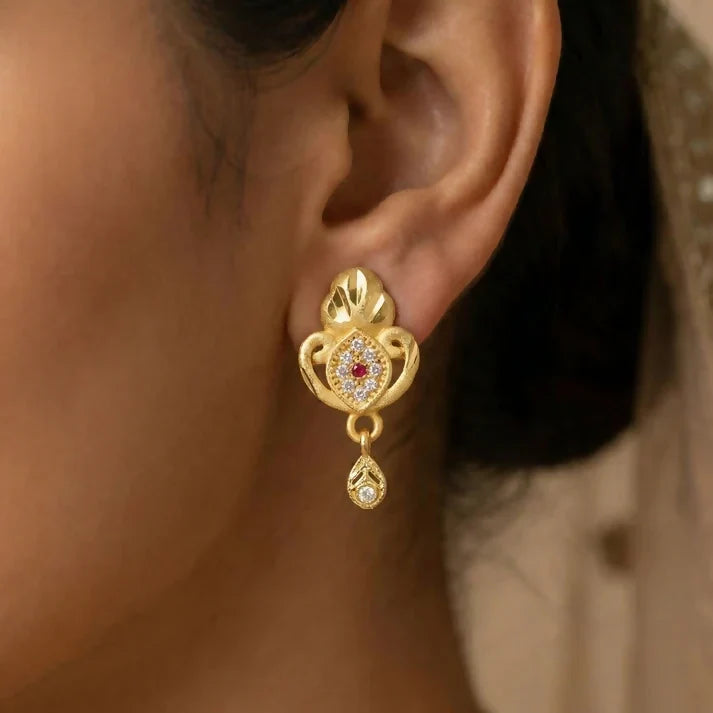 Gold Stud Earrings with Ethnic Floral Motif and Elegant Drop