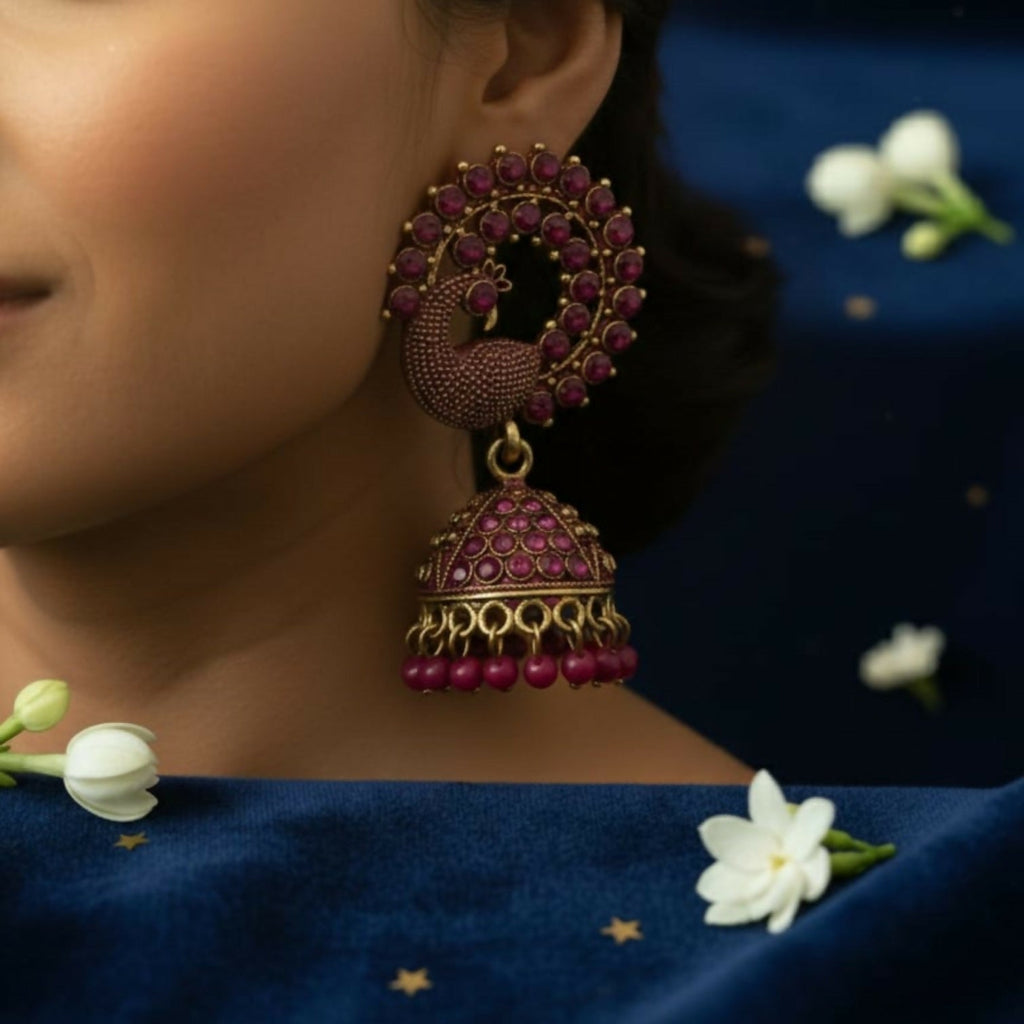 Peacock Motif Jhumka Earrings – Ruby-Tone Antique Gold Finish