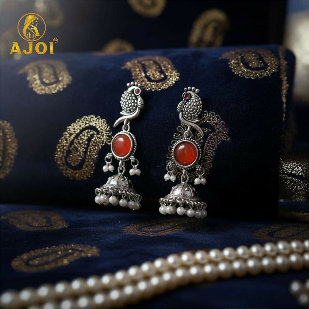 Peacock Jhumka Earrings – Antique Silver with Red Stone & Pearls