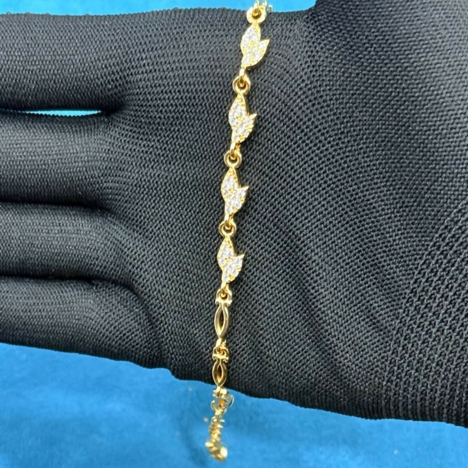 Delicate Gold-Tone Three Leaf Bracelet with Crystal Accents and Adjustable Chain