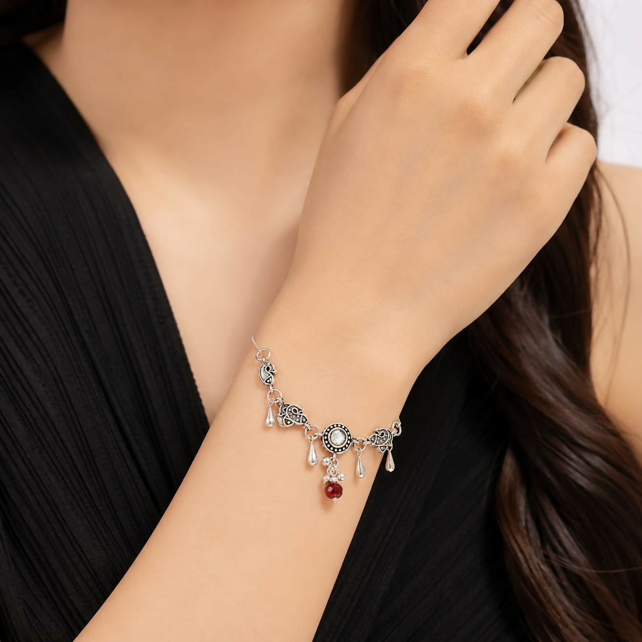 Oxidized Silver Peacock Bracelet with Kundan Stone & Red Bead Charms Adjustable Chain
