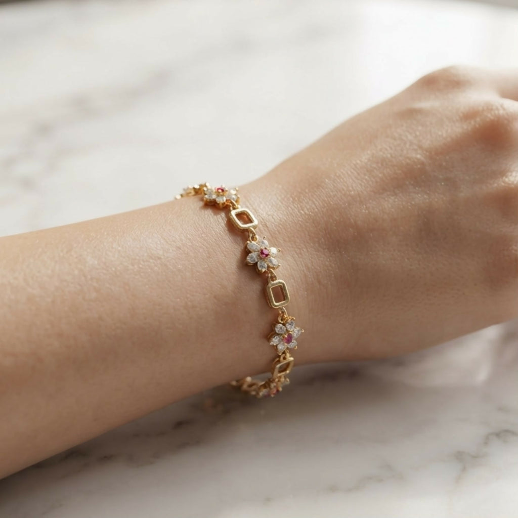 Gold-Tone Flower Link Bracelet with Pink Stones, Crystal Petals and Square Accents