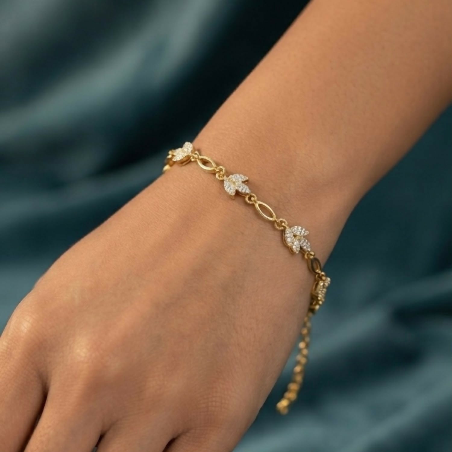 Delicate Gold-Tone Three Leaf Bracelet with Crystal Accents and Adjustable Chain