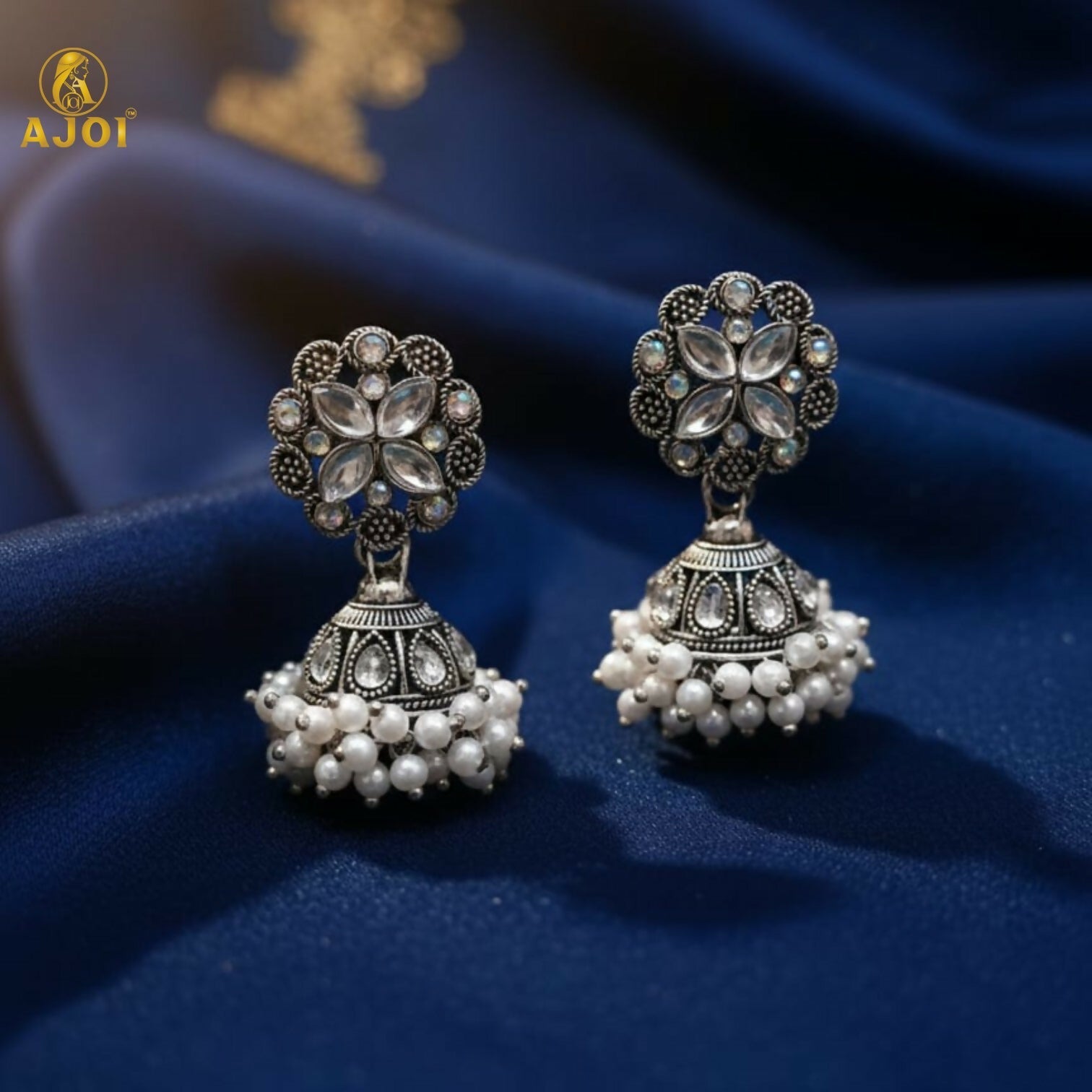 Silver Oxidized Floral Jhumka Earrings – Elegant Pearl Drops Design